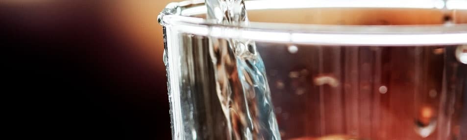 Clean water being poured into a glass