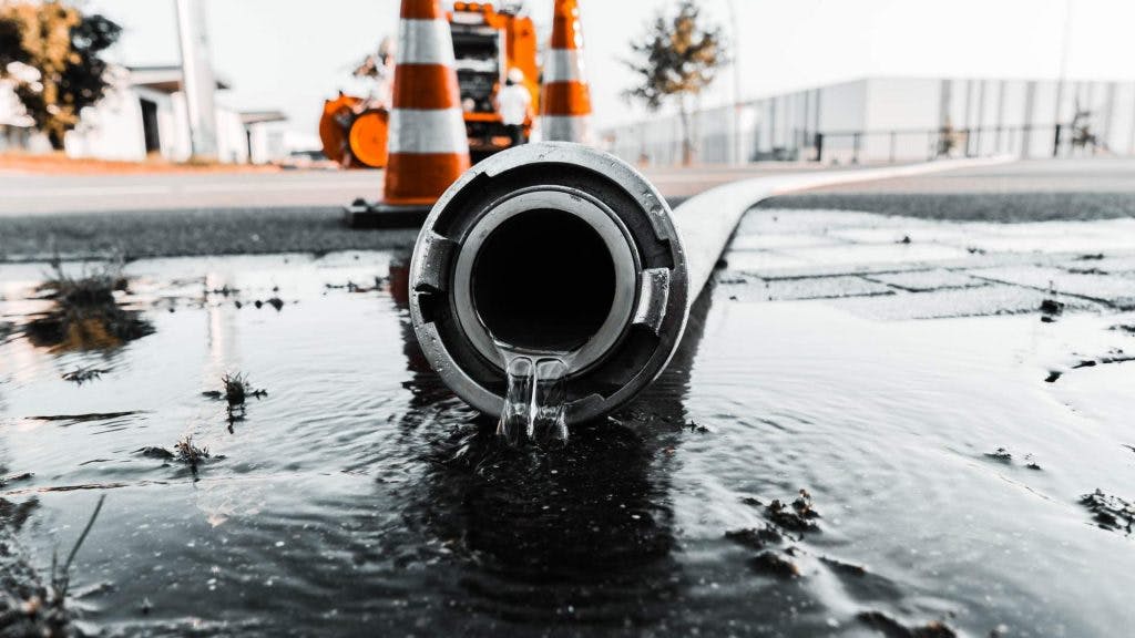 gray-pipe-with-water-coming-out-its-hole