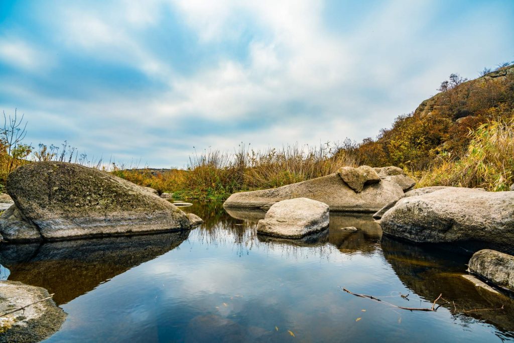 a-fast-clean-stream-runs-among-smooth-wet-stones-s-FXVZQGN